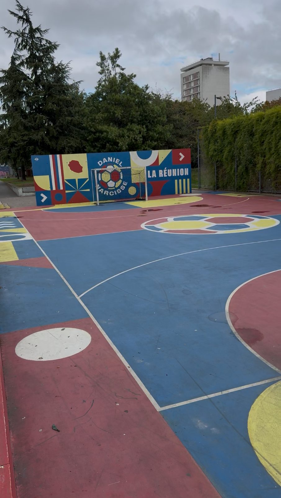 Painted street court with a mural in Paris