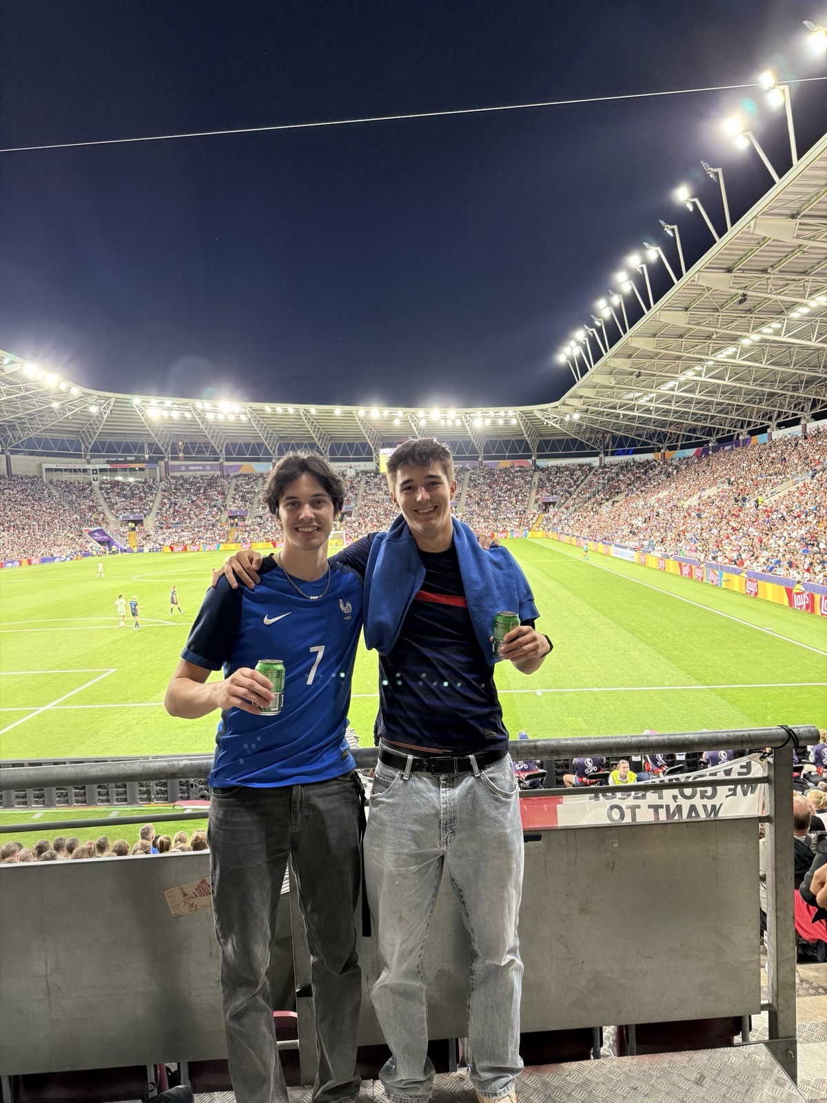 Two in France shirts at a night match